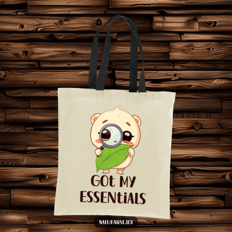 Funny tote bag featuring a creature scrutinizing a leaf with a magnifying glass, conveying a humorous sense of discovery, a useful funny gift.
